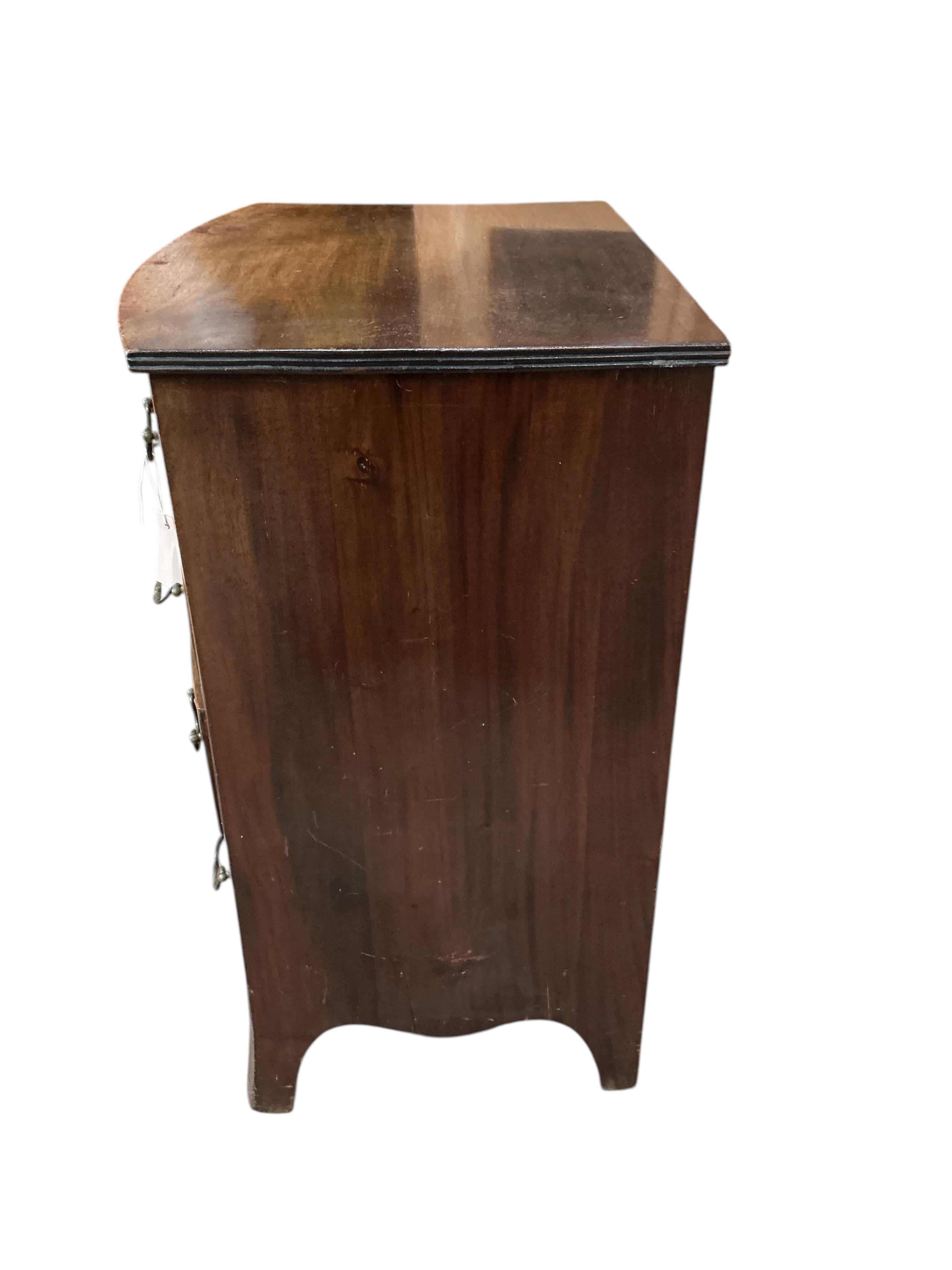 A small Regency style bow front four drawer mahogany chest, width 64cm, depth 48cm, height 84cm